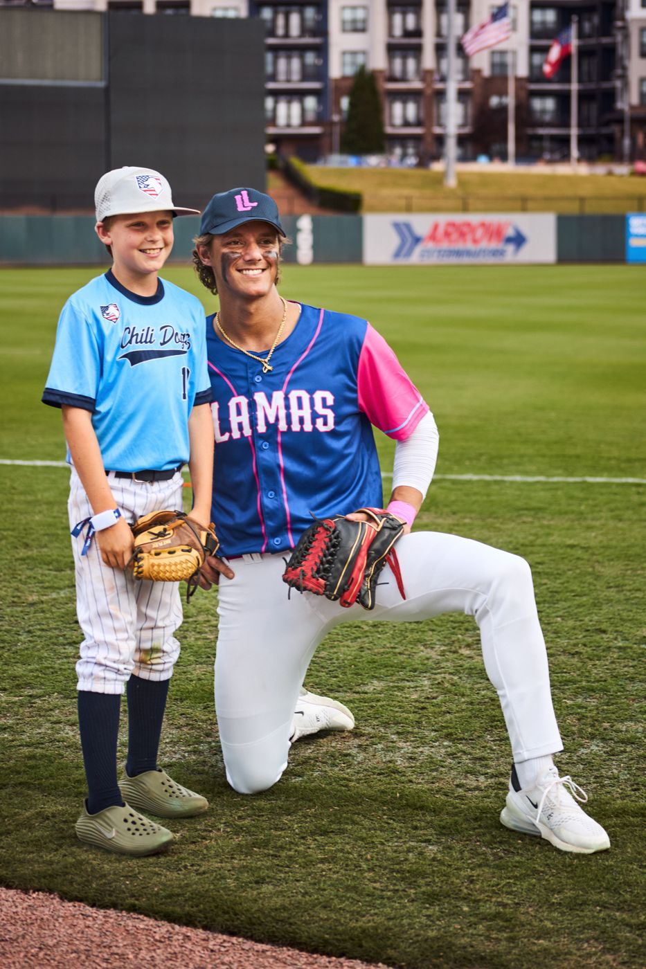 Two Lucky Llamas players kneeling on the field