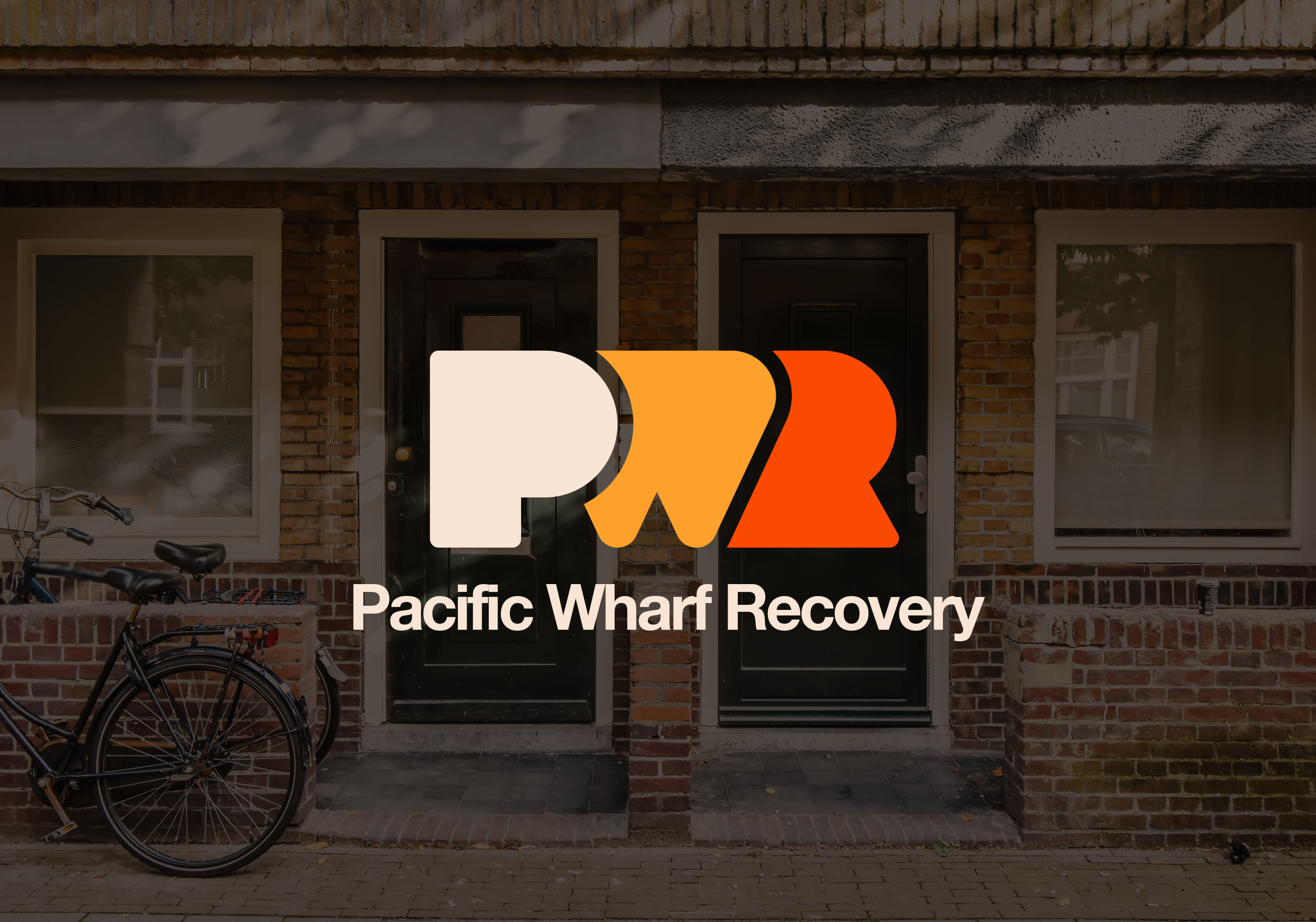 PWR Logo overlayed on an image of a house